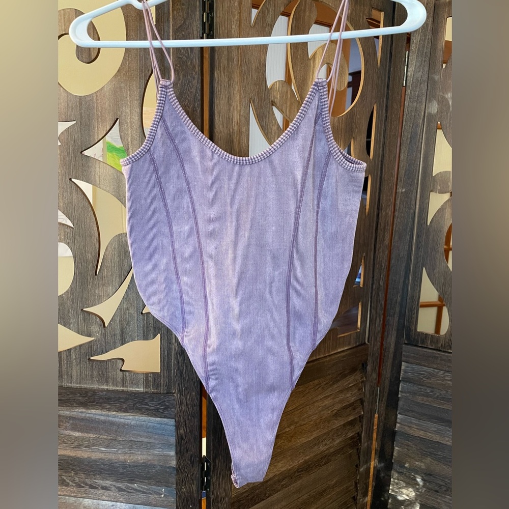 Soft purple tank body suit with snaps.